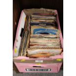 A TRAY OF 7 IN SINGLE RECORDS TO INCLUDE THE TREMOLOS, DUANE EDDY ETC