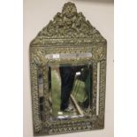 A DECORATIVE GILT MIRROR