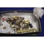 A BOX OF MILITARY TYPE BUTTONS AND BADGES