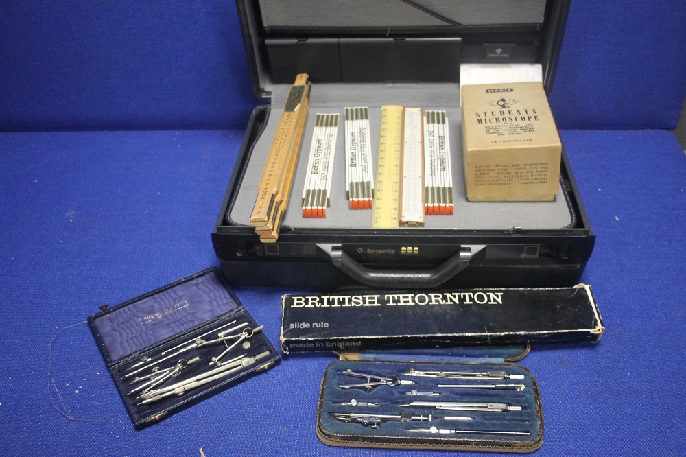 A COLLECTION OF VINTAGE RULERS, A STUDENTS MICROSCOPE, COMPASS SET ETC, CONTAINED IN A SAMSONITE