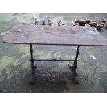 AN ANTIQUE CAST IRON TABLE