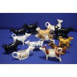 A COLLECTION OF CERAMIC JUGS IN THE FORM OF COWS TO INCLUDE BESWICK