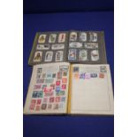 AN ALBUM OF STAMPS TO INCLUDE CHINESE EXAMPLES TOGETHER WITH AN ALBUM OF CIGARETTE CARDS