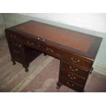 AN ANTIQUE LEATHER INLAID TWIN DESK