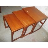 A RETRO TEAK NEST OF 3 SIDE TABLES IN THE STYLE OF G PLAN