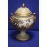 A PAINTED LIDDED TWIN HANDLED URN