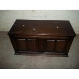 AN OAK BLANKET CHEST WITH LINEN FOLD DETAILING