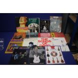 A COLLECTION OF MUSIC RELATED BOOKS TO INCLUDE THE POGUES, BOB DYLAN , BOWIE, RADIO HEAD ETC