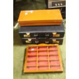 A PAIR OF BRIEFCASES, A SMALL VINTAGE LEATHER CASE A WALL MOUNTED DISPLAY CABINET ETC