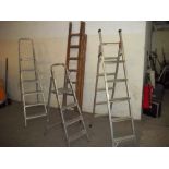 THREE SETS OF ALUMINIUM STEP LADDERS AND 1 SET OF TRIPPLE WOODEN LADDERS