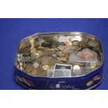 A TIN OF BRITISH AND WORLD COINS