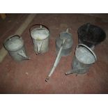 A SELECTION OF 4 GALVANIZED WATERING CANS AND BUCKET