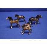 A COLLECTION OF 4 BESWICK PONIES