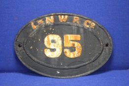 A CAST OVAL PAINTED RAILWAY SIGN