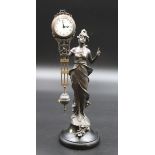 Bronzefigur im Jugendstil mit Uhr, Werk läuft, ca. H-33,5cm.