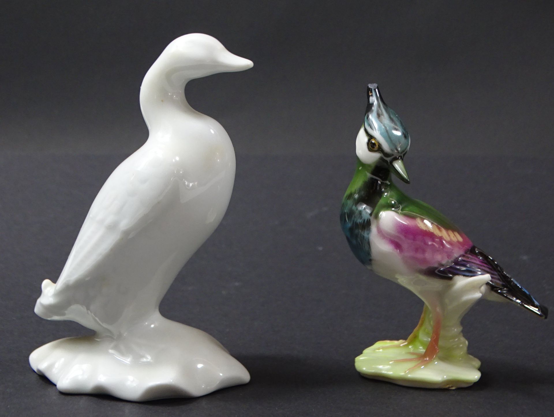 2 Porzellanvögel, Ente von Haviland Limoges, Kiebitz von Hutschenreuther, H. 9,5 und 8,5 cm, Kiebit