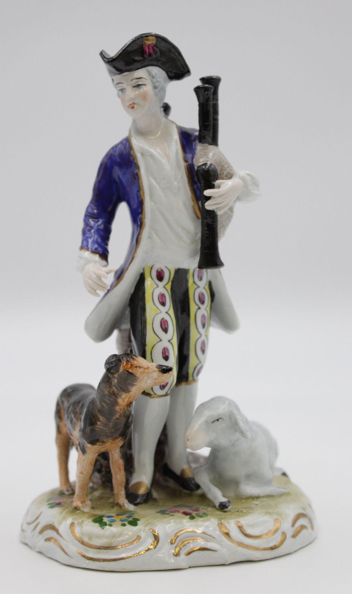 Figur, gemarkt, Knabe mit Dudelsack, Hund und Schaf, polychr. Bemalung, H-17cm.