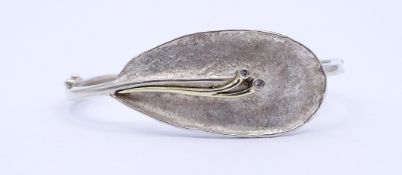 Armspange in 835er Silber, tw. vergoldet, 17,7g.