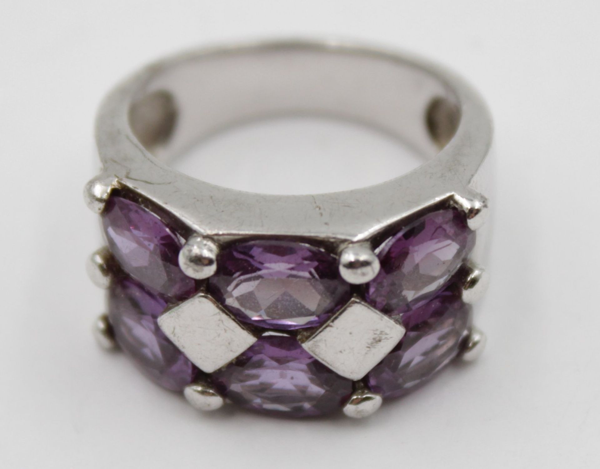925er Silber-Ring, lila facc. Steine, 10,5gr., RG 60