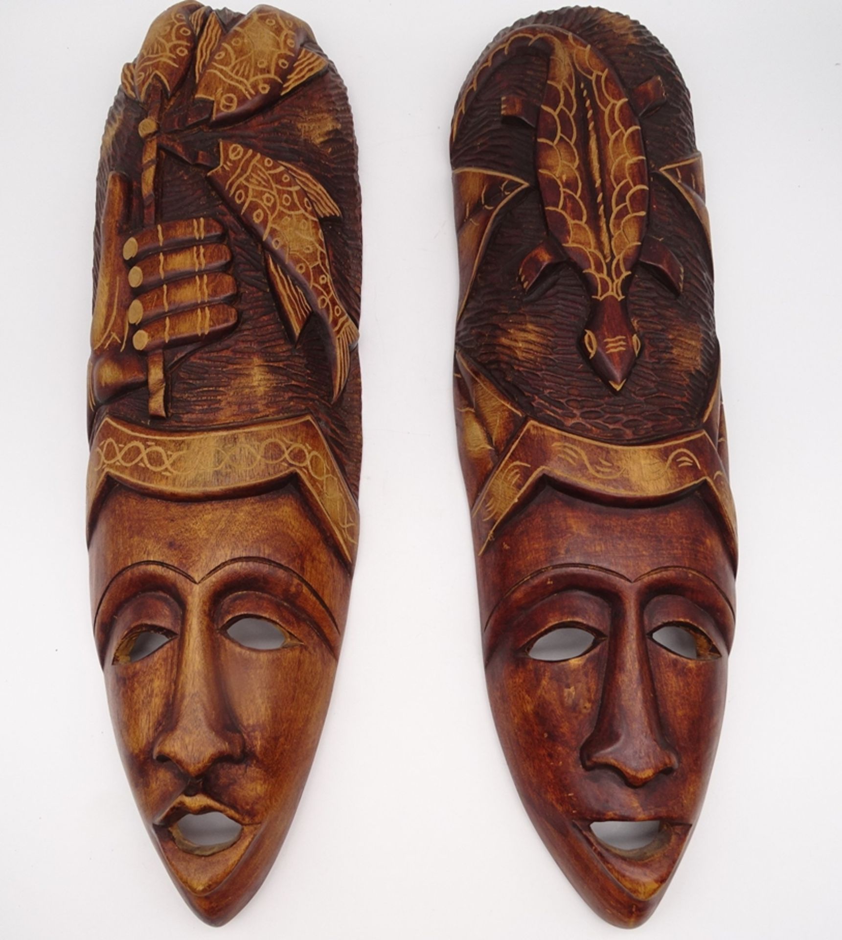 2 Holzmasken, Afrika?, L. 60 cm