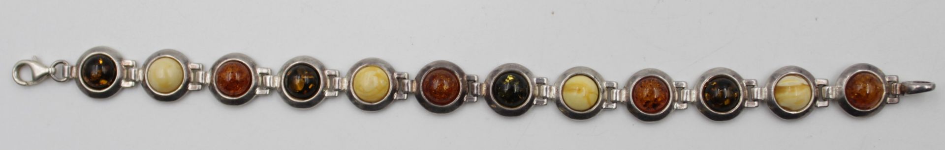 925er Silber-Armband mit Bernsteinbesatz, zus. 20,7gr., L-20,5cm.