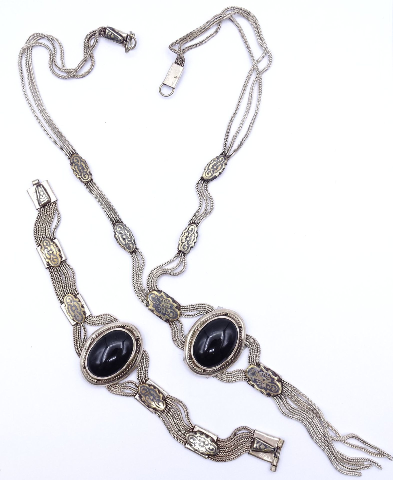 Schmuckset, Silber 0.900, Armband und Kette, beide mit Onyx Cabochons, zus. 95,5g., L. 19cm und 47c