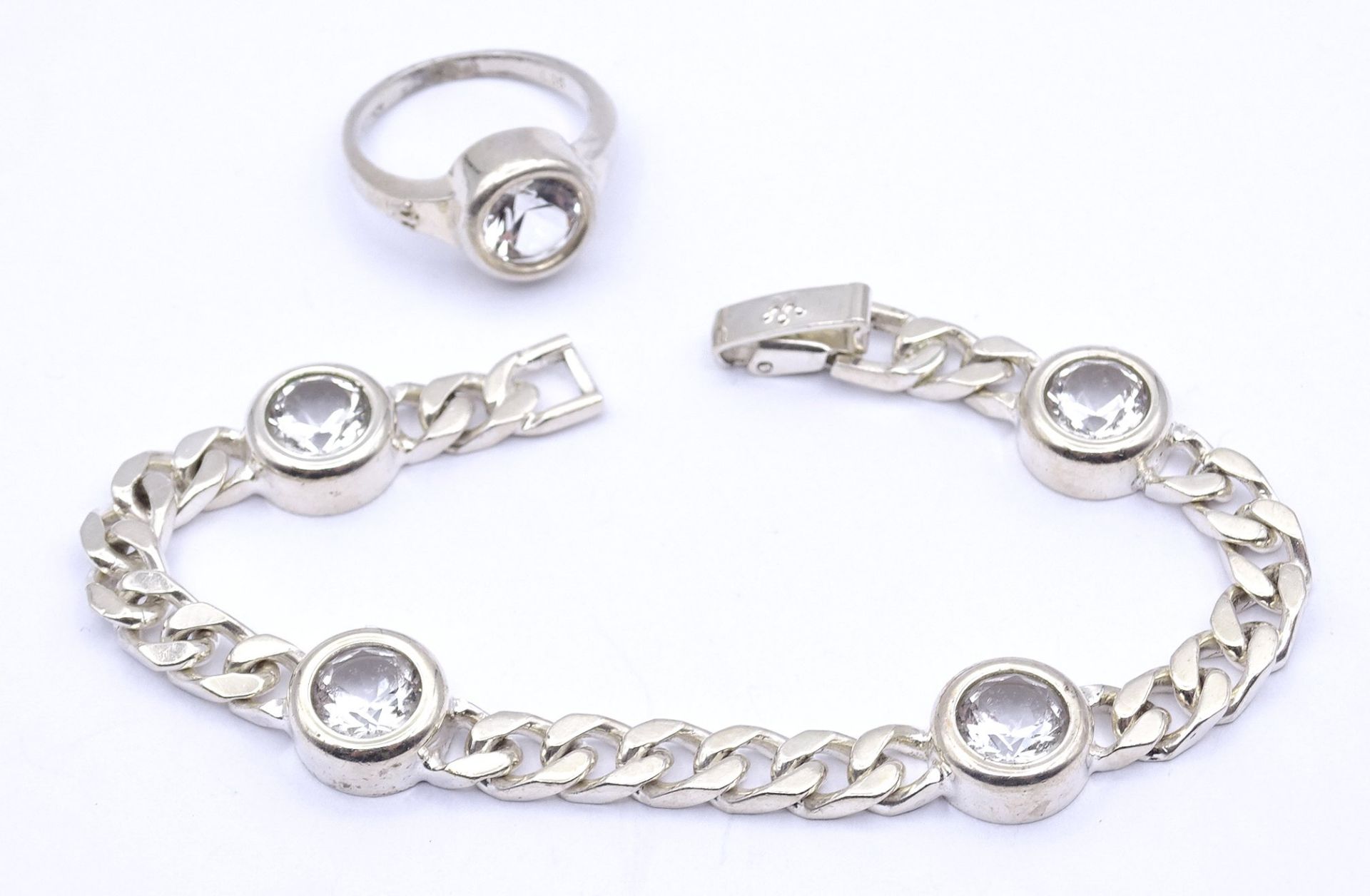 Armband und Ring, Silber 0.835 mit rund facc. klaren Steinen, L. 19,5cm, ges.Gew .31,2g., RG 58/59