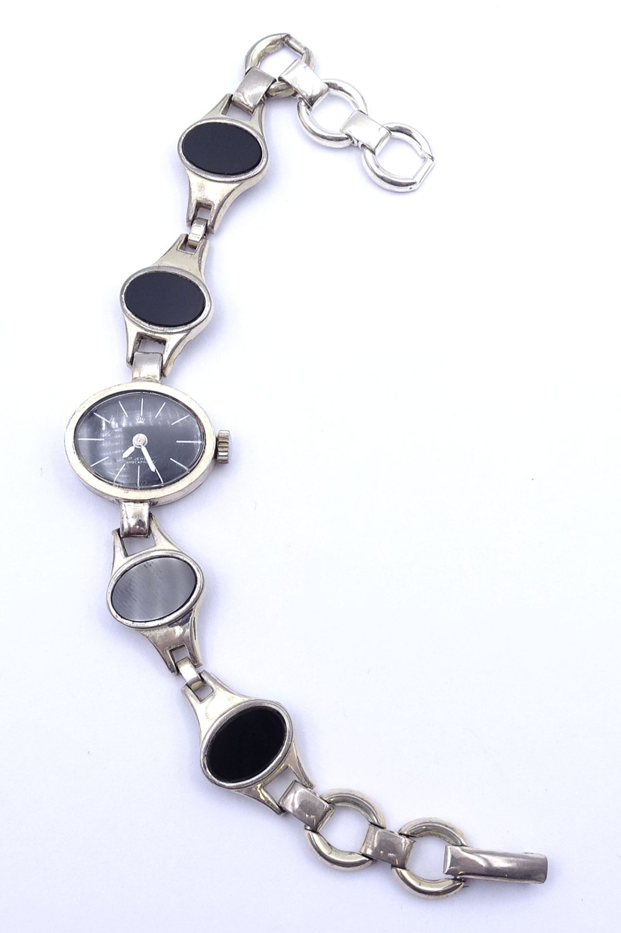 Damen Armbanduhr , Vollsilber 0.835, mechanisch, Werk läuft, mit Onyx Besatz, ges.Gew. 26,8g.