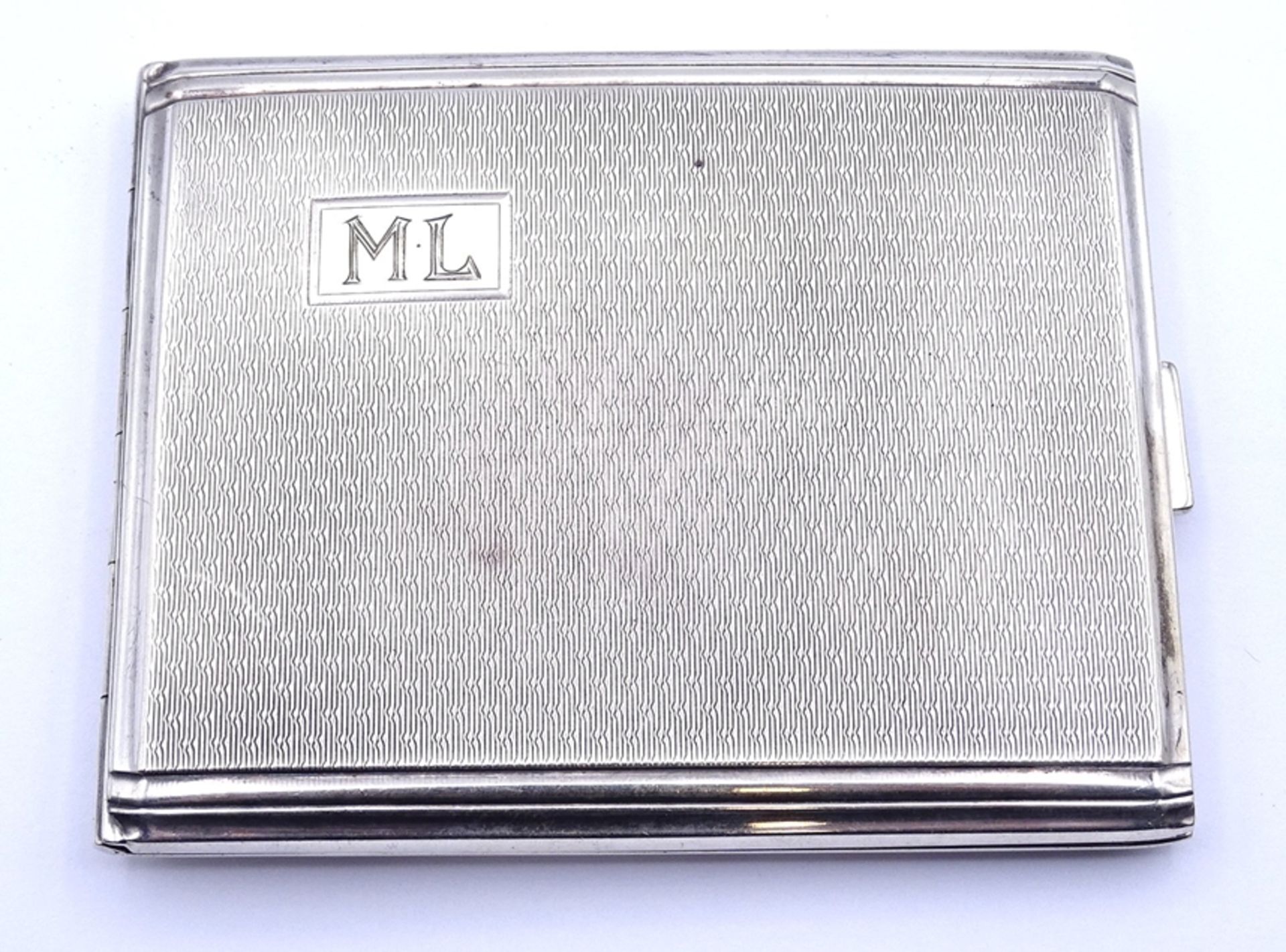 Zigaretten Etui, Silber 0.835, Initialen M.L. 7,4x9,2cm, 86g.