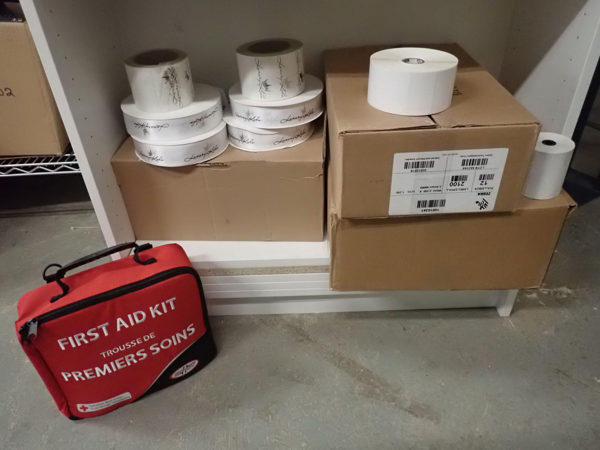 LOT - FIRST AID KIT, MICROWAVE, WHITE STICKER ROLLS, & RIBBON