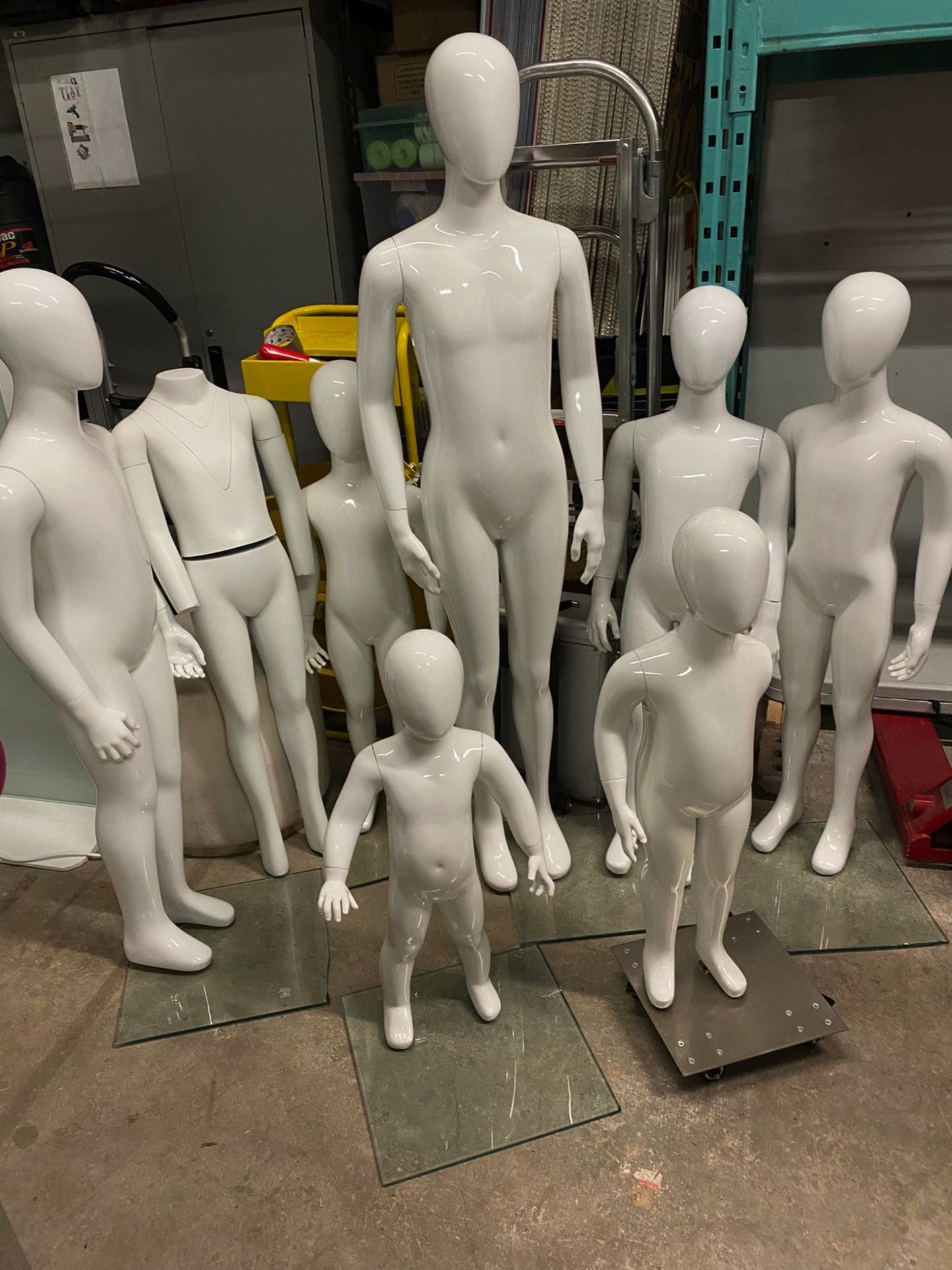 LOT - (8) ASSORTED MANNEQUINS, (5) GLASS BASES, (1) ROLLING METAL BASE, & (1) WHITE OTTOMAN
