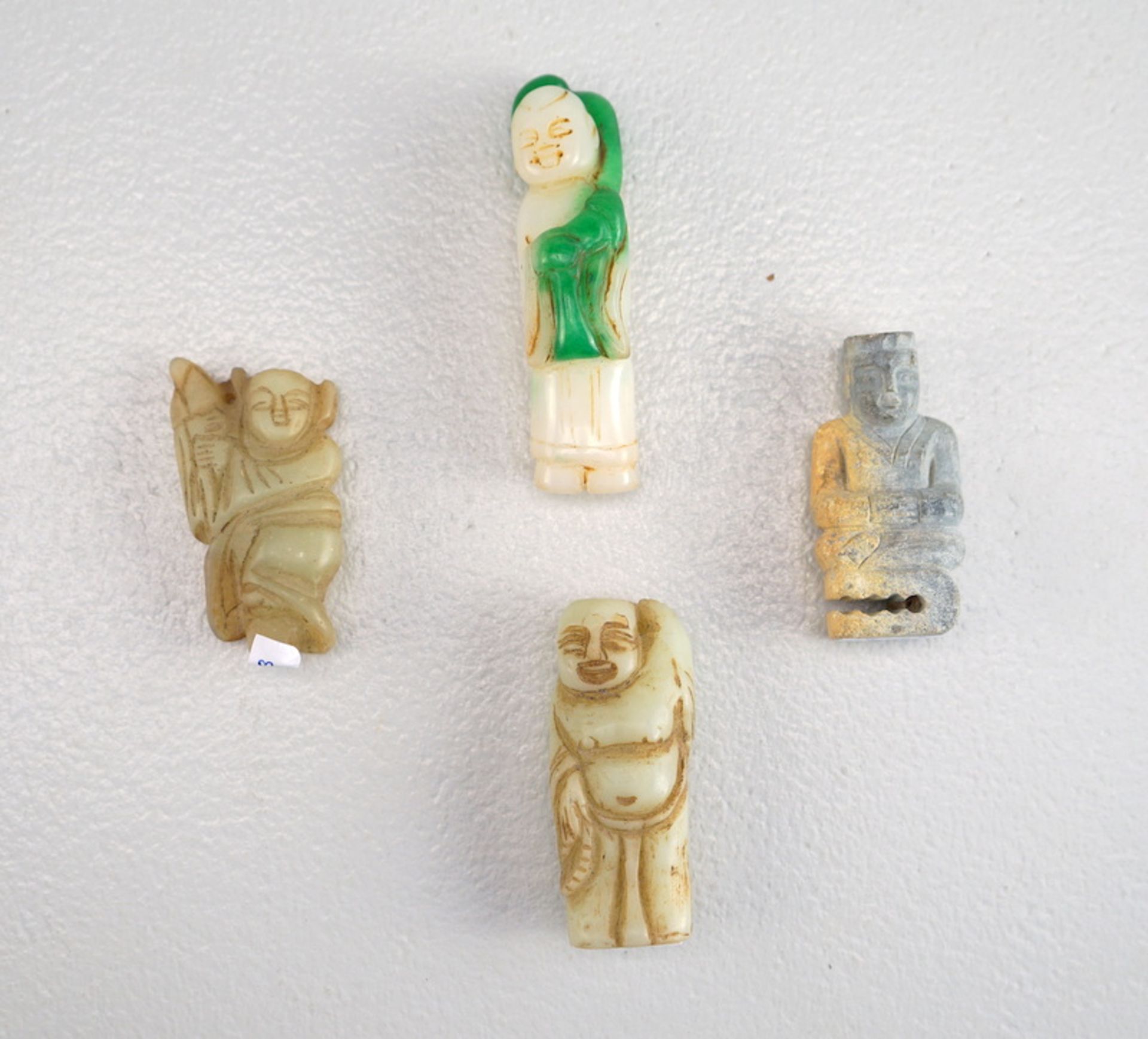 Vier kleine Buddha Figuren