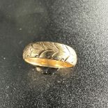 A 9ct yellow gold fancy wedding band