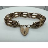 A 9ct rose gold vintage gate bracelet