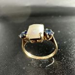 A 9ct yellow gold opal + sapphire dress ring