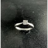 A platinum single solitaire ring