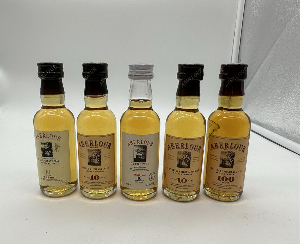 A collection of miniature whisky bottles