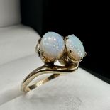 A 9ct yellow gold opal twist ring