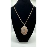 A 9ct rose gold large Victorian Antique locket