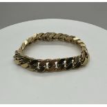 An 18ct yellow gold heavy curb link bracelet