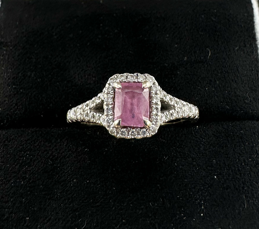 An 18ct white gold pink sapphire + diamond ring