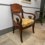 A 19th century Russian figured mahogany open armchair with carved scroll and anthemion arms, drop in