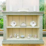 A Chinese Chippendale style painted and distressed open bookcase with blind fretwork chinoiserie.