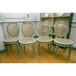 A set of four Louis XVI style, 19th century carved and painted cameo backed side chairs with split