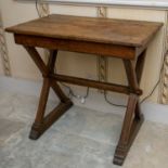 A Victorian oak gothic Puginesque 'X' frame trestle type side table with sledge feet. 87cm wide x