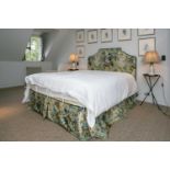 A floral chintz upholstered crow stepped double headboard, together with matching valence. (2)