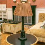 A Victorian patinated bronze architectural table lamp with cluster column support and a niched