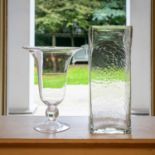 A large contemporary clear glass trumpet form vase with knop stem and spreading foot, together