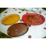 A group of three 20th century oval decorative japanned gallery serving trays. One decorated with