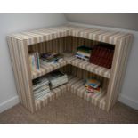 A matching fabric covered 'L' shaped open bookcase. 97cm wide x 97cm long x 93cm high.Provenance: